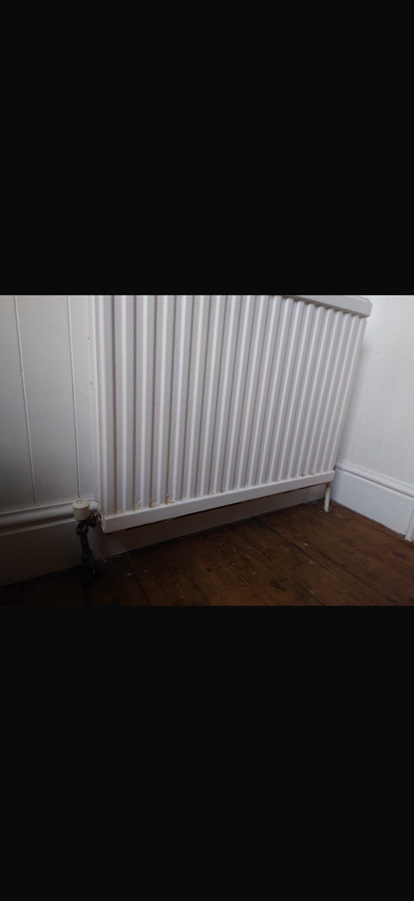 Standard panel radiator before replacement at an Aylestone home