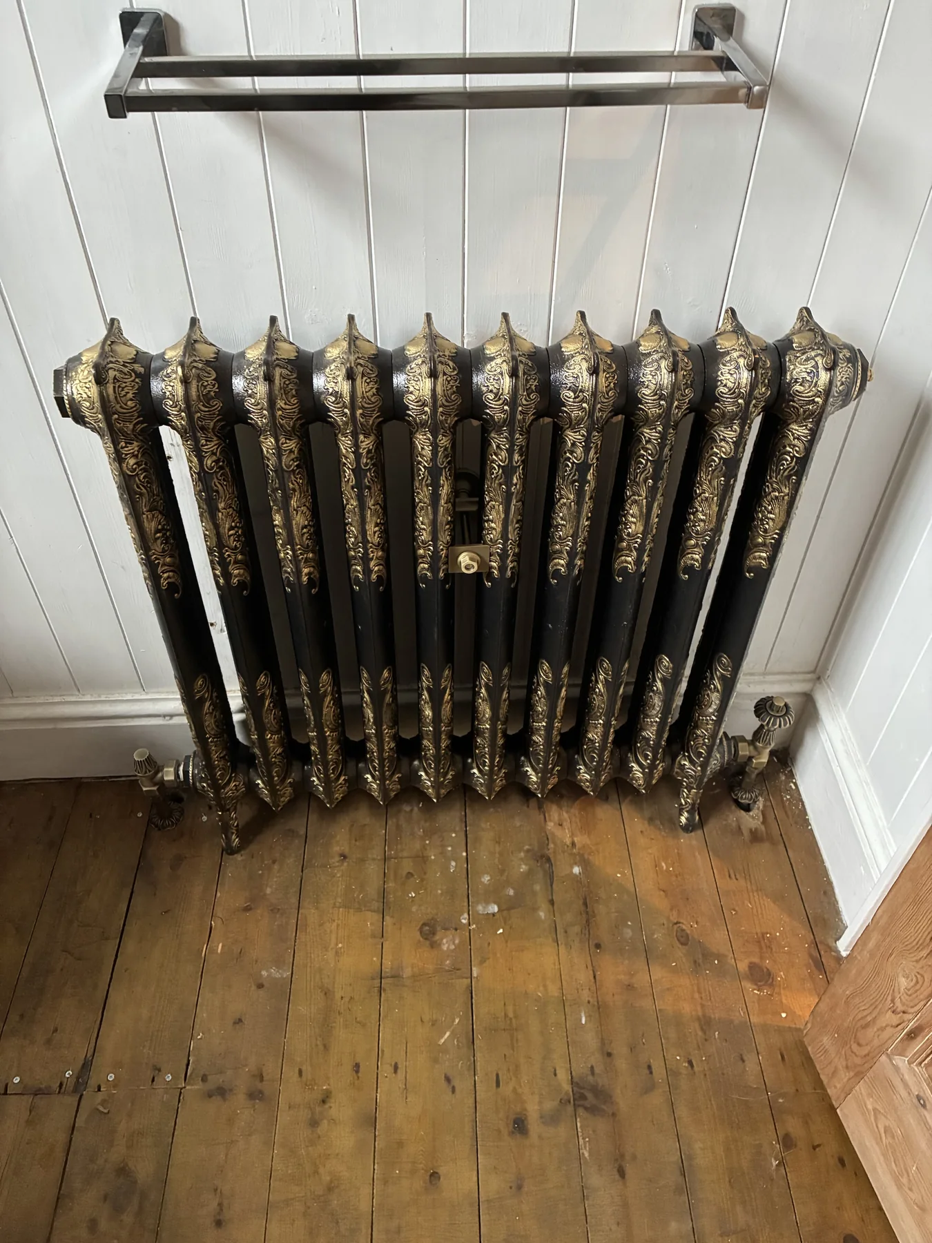 Finished black-and-gold ornate radiator installed by AFS in Aylestone, Leicester