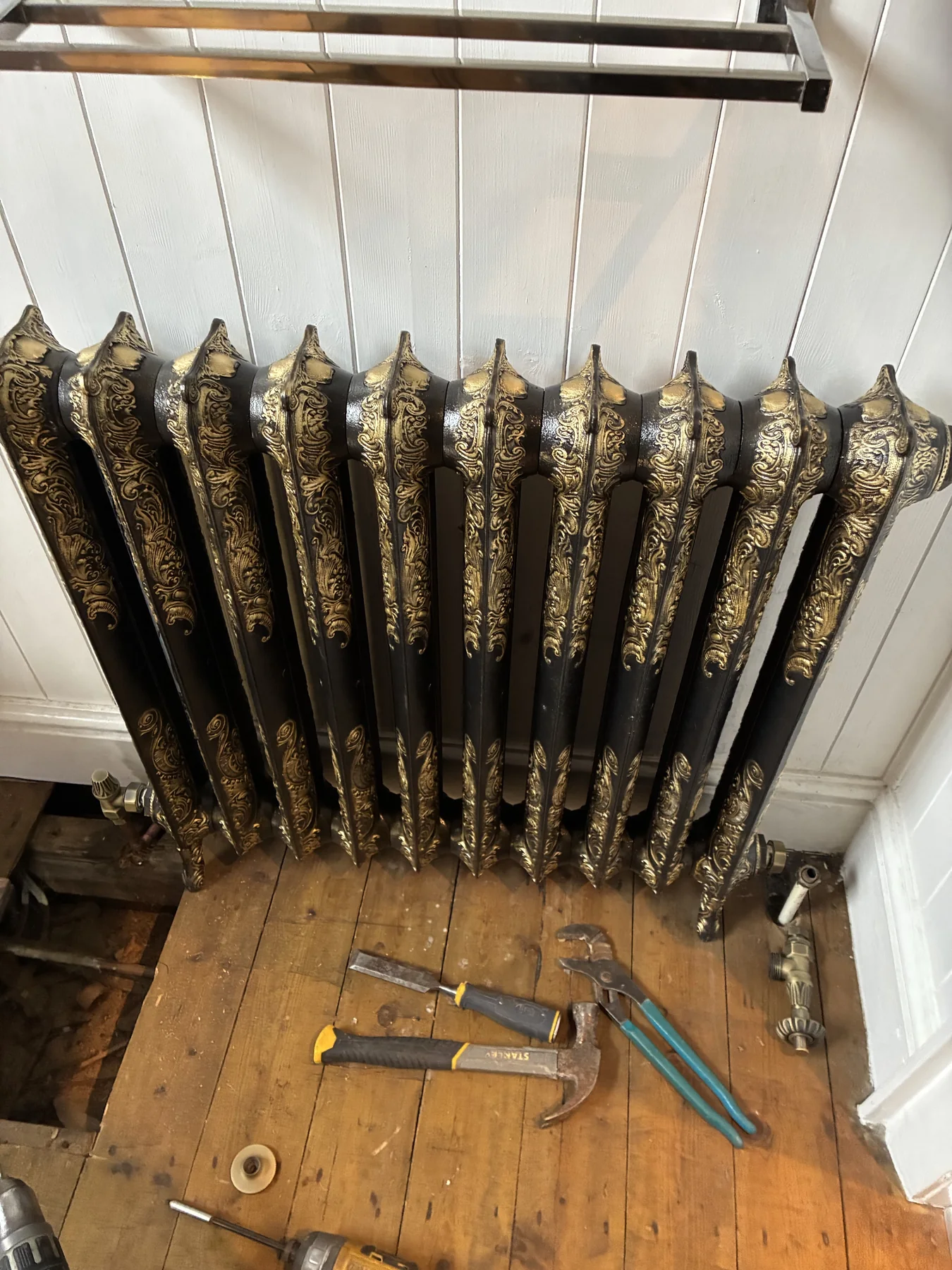 Floorboard access and pipework alterations during an Aylestone radiator installation