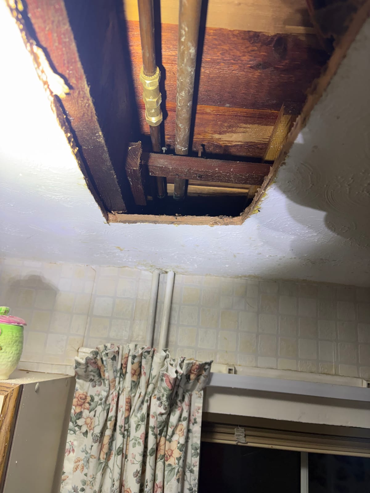 Pinhole pipe repair reached through controlled ceiling access in Braunstone