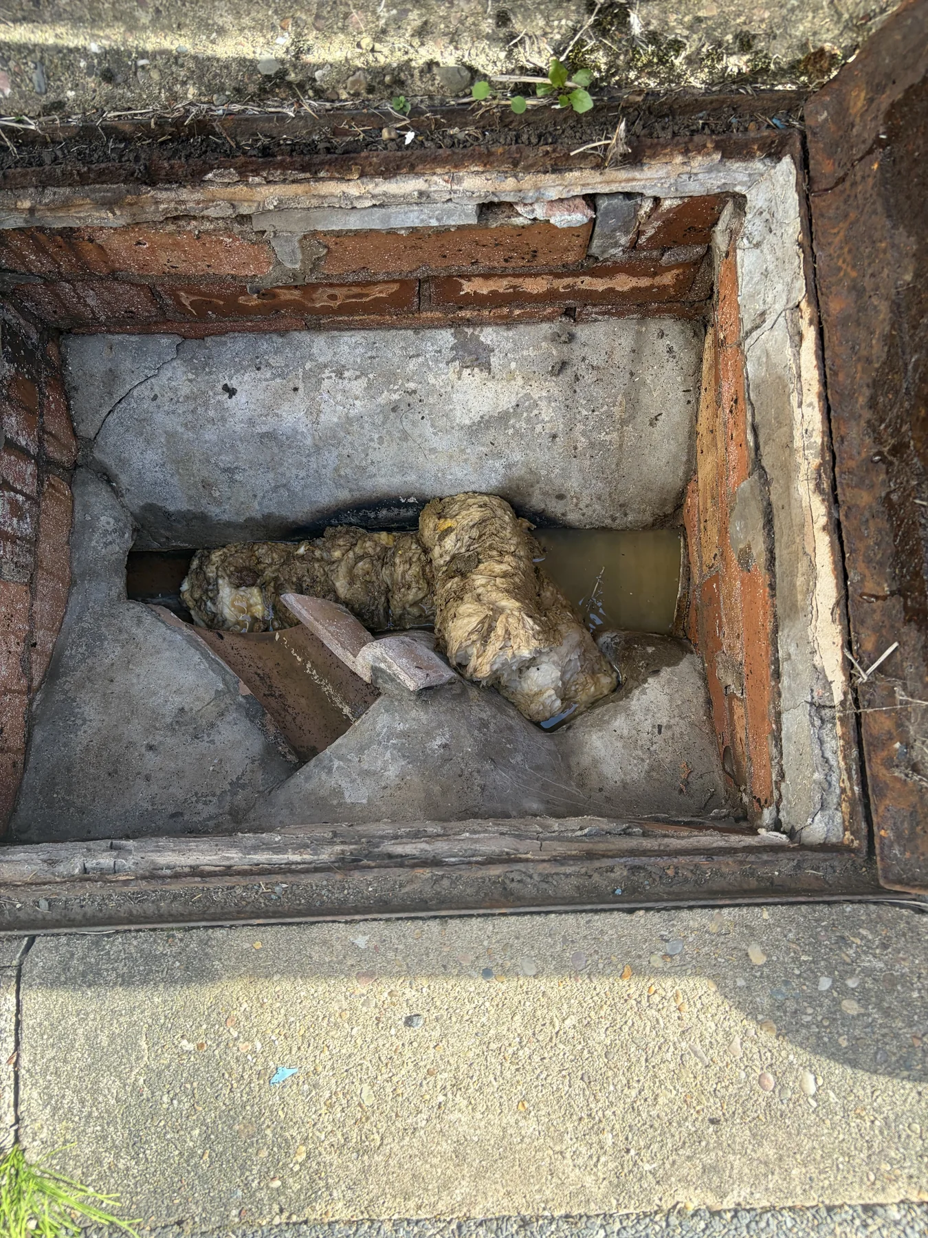 Obstruction found in the main manhole during an emergency blocked toilet call-out in Broughton Astley