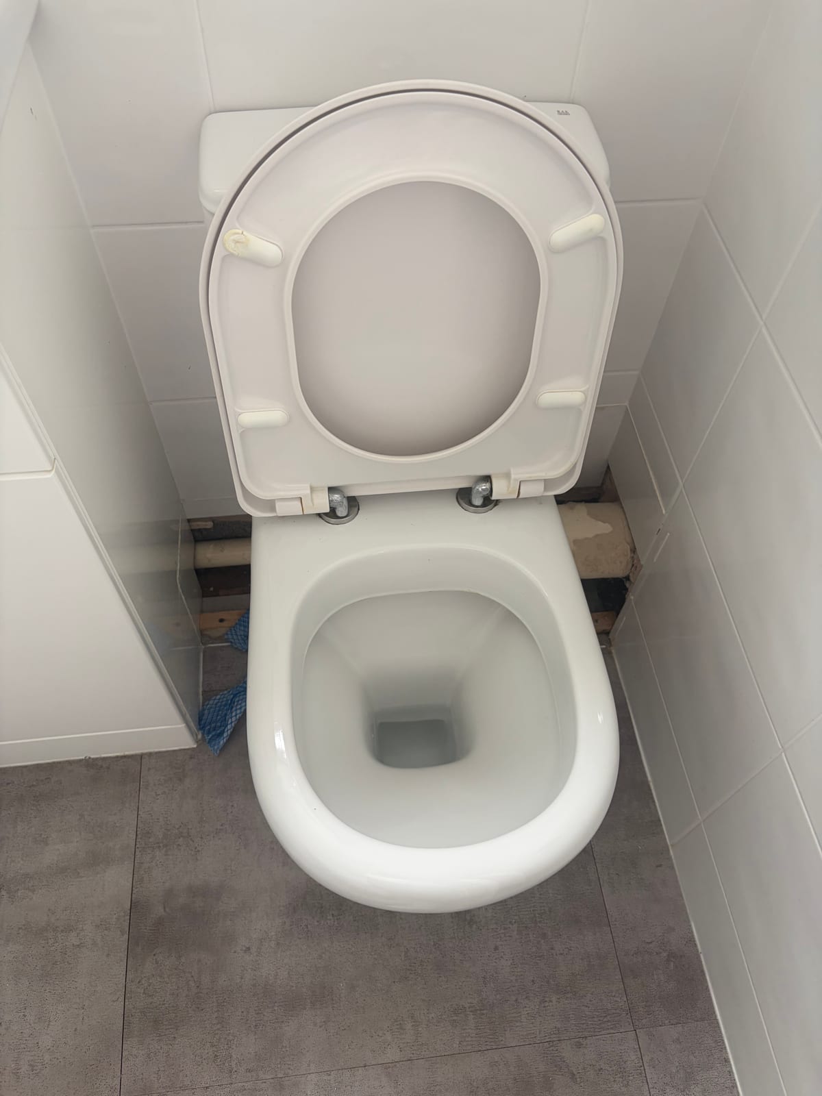 Toilet reinstalled and tested after a leaking pan connector repair in Earl Shilton