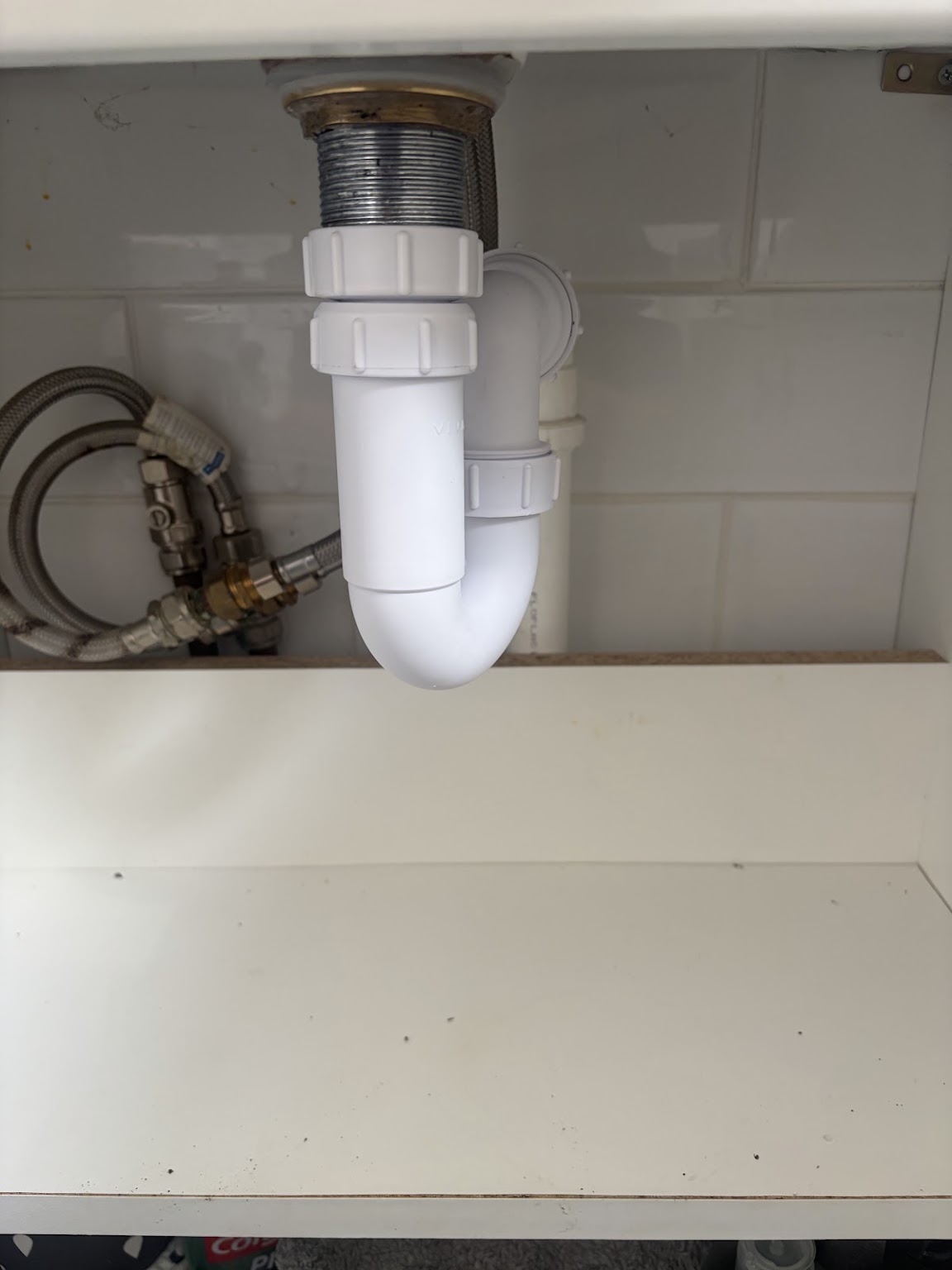 Basin waste pipework repaired beneath a bathroom basin in Glenfield
