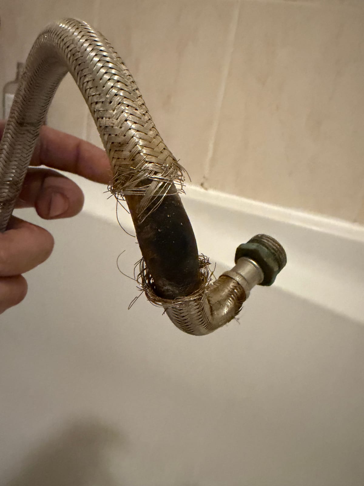 Burst braided flexible hose removed during an emergency call-out in Lutterworth