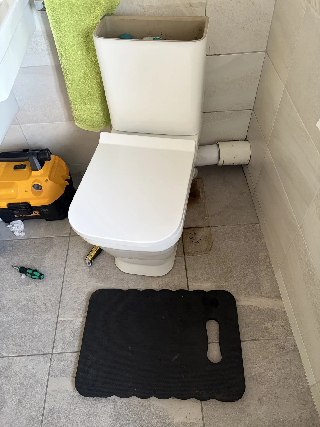 Toilet being removed to replace a perished pan connector in Mountsorrel