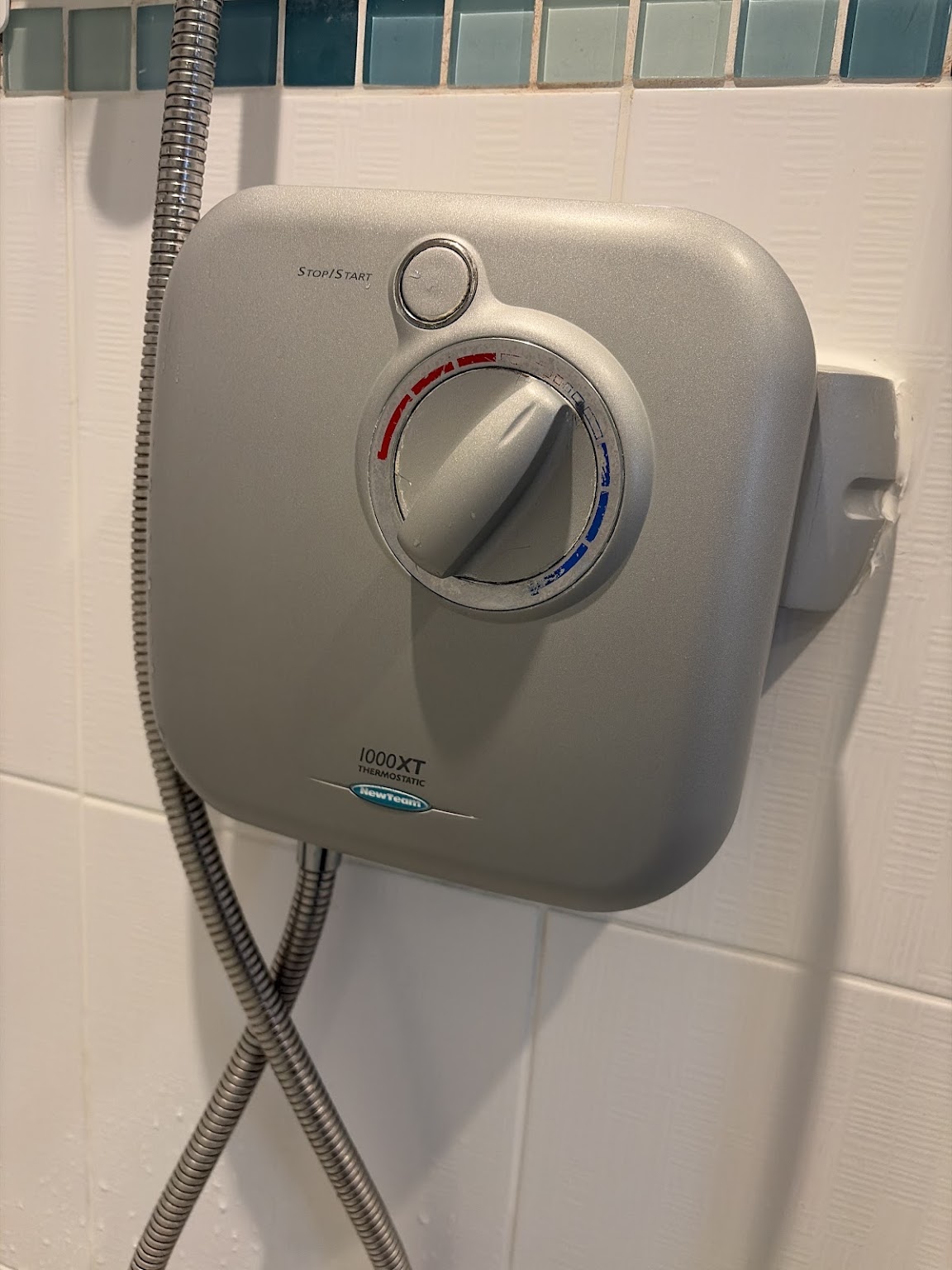 Existing power shower assessed before replacement in Narborough