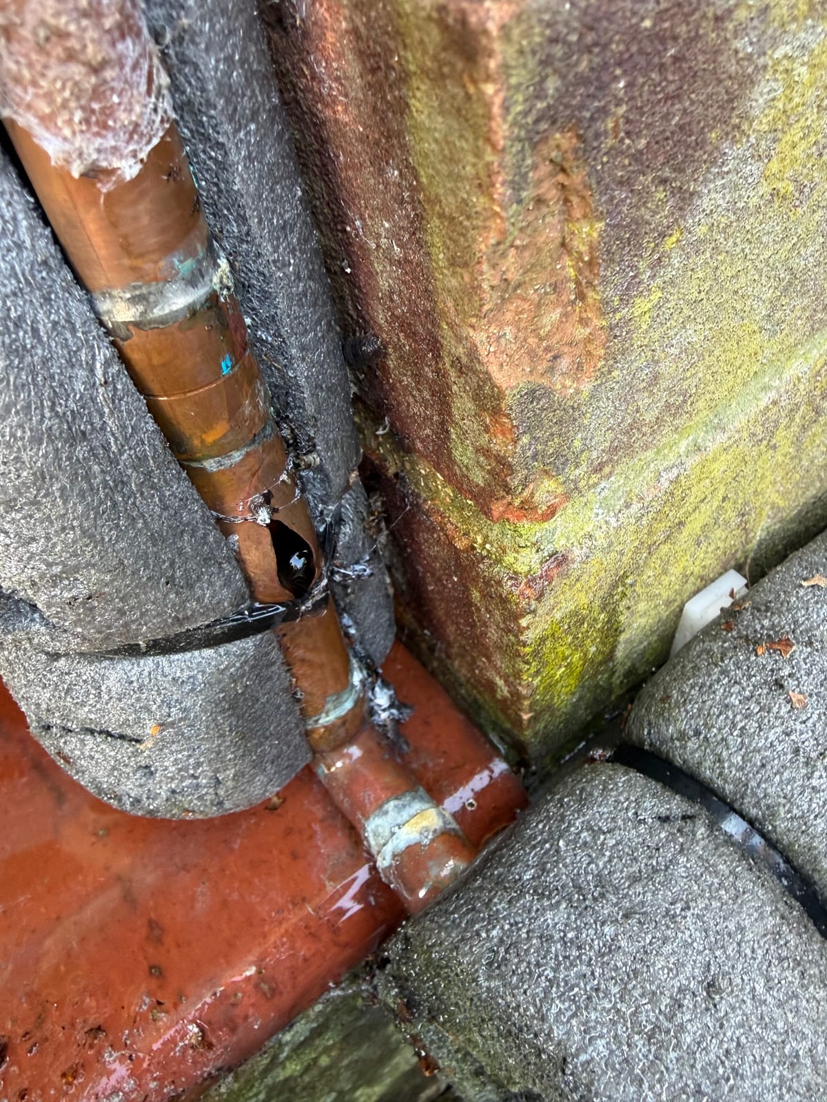Outside copper pipe split by freezing weather at a Whetstone property