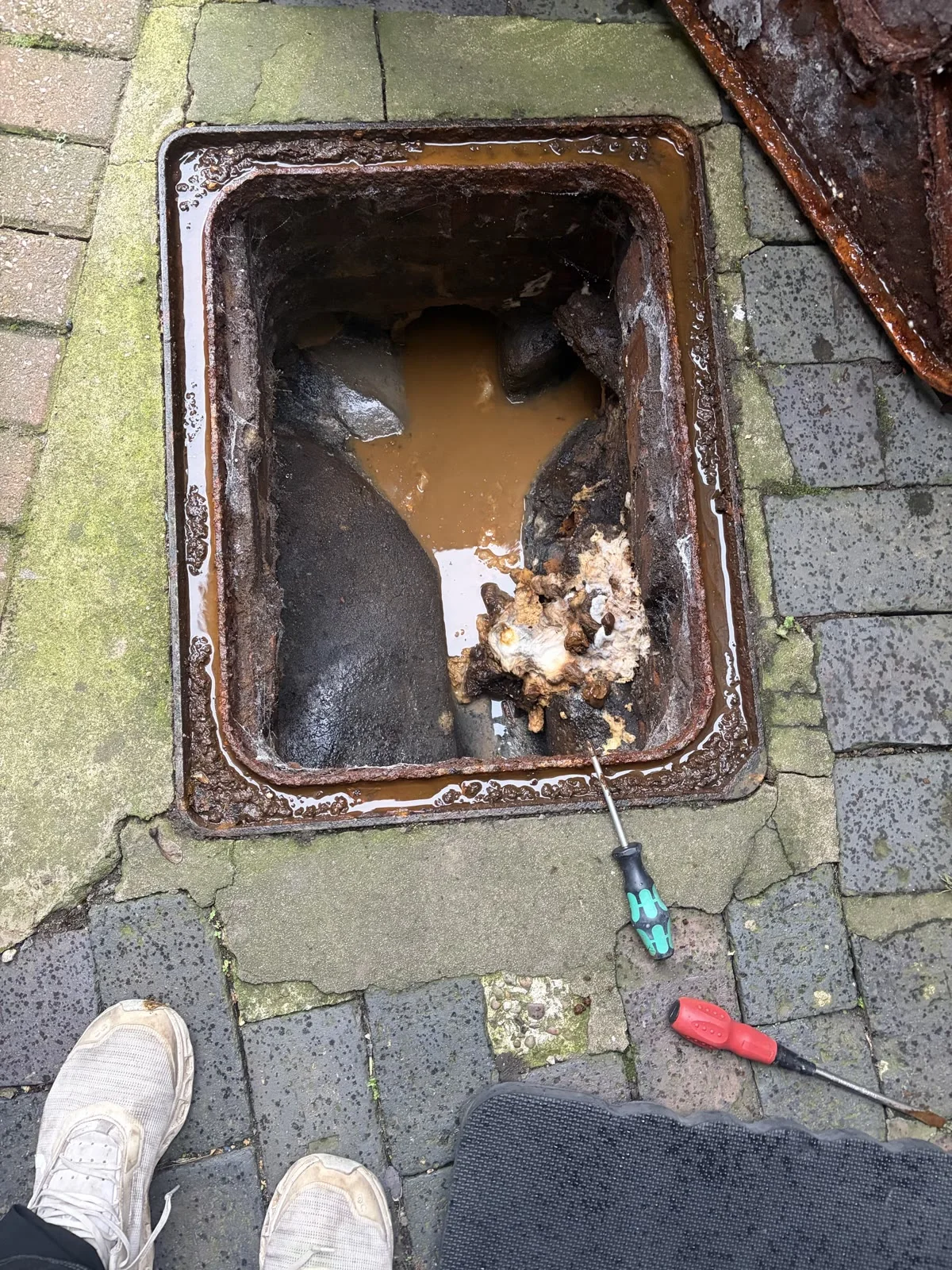 Wet-wipe and toilet-tissue blockage found in an outside drain during an emergency call-out in Enderby