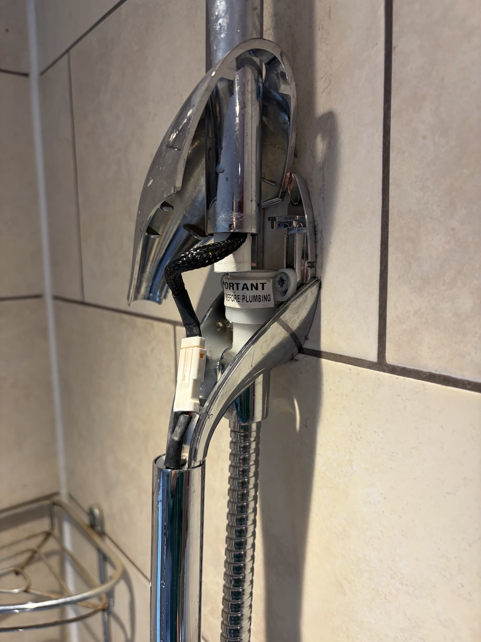 Close-up of the shower pipework checked after a Speedfit connection fault in Leicester Forest East